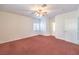 The bright bedroom features carpet, a ceiling fan, and two windows providing lots of light at 1056 Flatfoot Ave, Henderson, NV 89012