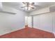 Bedroom with a ceiling fan, built-in shelves, and closet for storage and comfort at 1056 Flatfoot Ave, Henderson, NV 89012