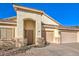 Inviting front door area with convenient 2 car garage at 1056 Flatfoot Ave, Henderson, NV 89012