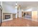 This spacious living area has a fireplace, wood floors, and is open to the kitchen at 1056 Flatfoot Ave, Henderson, NV 89012