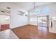 The large living room features wood flooring, a fireplace, large windows and sliding doors at 1056 Flatfoot Ave, Henderson, NV 89012