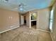 Bright carpeted bedroom features a ceiling fan and access to an ensuite bathroom at 10840 Holmfield St, Henderson, NV 89052