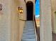 Inviting stairway leading to the main entrance, illuminated by stylish outdoor lighting at 10840 Holmfield St, Henderson, NV 89052