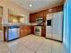 Well-lit kitchen with stainless steel appliances, wooden cabinets, and granite countertops at 10840 Holmfield St, Henderson, NV 89052
