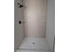 Modern shower featuring a mosaic tile floor and a rainfall shower head at 121 Comstock St, Pahrump, NV 89048