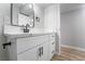 Modern bathroom with a new vanity, black hardware, and stylish mirror at 142 Ivy St, Henderson, NV 89015