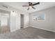 Cozy bedroom with a window, ceiling fan, and closet, offering comfort and storage at 142 Ivy St, Henderson, NV 89015