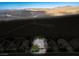 Expansive aerial view of a suburban neighborhood, showcasing desert landscape backdrop at 2012 Poetry Ave, Henderson, NV 89052