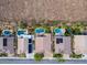 Panoramic aerial view of several homes with private pools, and lush landscaping at 2012 Poetry Ave, Henderson, NV 89052