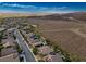 Expansive aerial view of a desert community with private homes, each with refreshing backyard pools at 2012 Poetry Ave, Henderson, NV 89052
