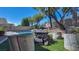 Inviting backyard with a pool, fire pit, and seating at 2012 Poetry Ave, Henderson, NV 89052