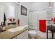 Bathroom with granite countertop, white cabinets, and a shower at 2012 Poetry Ave, Henderson, NV 89052