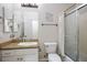 Clean bathroom with granite countertop, white cabinets, and shower/tub combo at 2012 Poetry Ave, Henderson, NV 89052