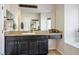 Bathroom featuring a large mirror and vanity with drawers and cabinets at 2012 Poetry Ave, Henderson, NV 89052