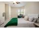 Bright bedroom with built-in workspace and green blanket at 2012 Poetry Ave, Henderson, NV 89052