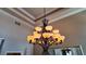 Ornate chandelier with multiple lights adds elegance and charm to the interior space at 2012 Poetry Ave, Henderson, NV 89052
