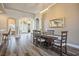 Open-concept dining area featuring hardwood floors and views of the living space at 2012 Poetry Ave, Henderson, NV 89052