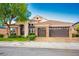 Charming single-Gathering home showcasing a meticulously maintained lawn and a spacious three-car garage at 2012 Poetry Ave, Henderson, NV 89052