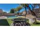 Relaxing fire pit area with seating and landscaping at 2012 Poetry Ave, Henderson, NV 89052