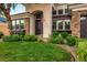 Attractive home with a stone accent, desert landscaping, well maintained yard, and a covered entry way at 2012 Poetry Ave, Henderson, NV 89052