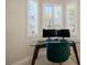 Home office with built-in window seat and glass desk at 2012 Poetry Ave, Henderson, NV 89052