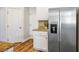 Kitchen with stainless steel appliances, granite countertops, and wood flooring at 2012 Poetry Ave, Henderson, NV 89052