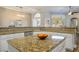 Bright kitchen featuring granite countertops, white cabinetry and stainless steel appliances at 2012 Poetry Ave, Henderson, NV 89052