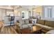Spacious living room featuring an open floor plan and hardwood floors at 2012 Poetry Ave, Henderson, NV 89052