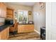 Office featuring wood laminate floors, built-in cabinets and a window with shutters at 2012 Poetry Ave, Henderson, NV 89052