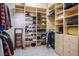 Spacious walk-in closet featuring lots of shelving and hanging storage at 2012 Poetry Ave, Henderson, NV 89052