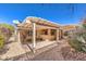 Private backyard patio features pergola cover, desert landscaping and leads to the house at 2277 Canyonville Dr, Henderson, NV 89044