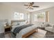 Digitally staged main bedroom with a large window and a neutral color scheme at 2301 Bahama Point Ave, North Las Vegas, NV 89031