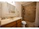 Bathroom featuring a single sink vanity and shower with a shower curtain at 271 Greenbriar Townhouse Way, Las Vegas, NV 89121