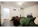 The bedroom features wood-look floors, closet with mirrored doors, and built in shelving at 271 Greenbriar Townhouse Way, Las Vegas, NV 89121