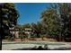 Relaxing community pool surrounded by mature landscaping offering residents a serene outdoor retreat on a sunny day at 271 Greenbriar Townhouse Way, Las Vegas, NV 89121