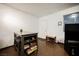 Hallway and entryway with wood floors, white walls, and natural lighting at 271 Greenbriar Townhouse Way, Las Vegas, NV 89121