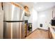 Kitchen with stainless steel fridge and a door leading to the outside at 271 Greenbriar Townhouse Way, Las Vegas, NV 89121