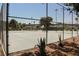 Community tennis courts behind fencing, showcasing the neighborhood's recreational amenities and landscape at 271 Greenbriar Townhouse Way, Las Vegas, NV 89121