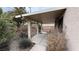 Covered backyard patio with desert landscaping at 2717 El Milagro St, Las Vegas, NV 89108