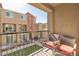 Private balcony with patio furniture and community view at 2827 Blue Mosaic Ln # 3, Las Vegas, NV 89183