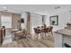 Elegant dining area with wood table and leather chairs at 2827 Blue Mosaic Ln # 3, Las Vegas, NV 89183