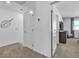 Simple hallway with carpet flooring and doors to bedrooms at 2827 Blue Mosaic Ln # 3, Las Vegas, NV 89183
