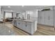 Bright kitchen features a large island, modern appliances, and white cabinetry at 2827 Blue Mosaic Ln # 3, Las Vegas, NV 89183