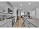 Modern kitchen with granite countertops, stainless steel appliances, and open view to the living area at 2827 Blue Mosaic Ln # 3, Las Vegas, NV 89183