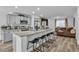Bright kitchen features granite countertops, stainless appliances, and an island with barstool seating at 2827 Blue Mosaic Ln # 3, Las Vegas, NV 89183