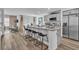 Modern kitchen boasts stainless steel appliances, granite countertops, and a breakfast bar with seating at 2827 Blue Mosaic Ln # 3, Las Vegas, NV 89183
