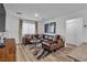 Spacious living room featuring a large sectional sofa and stylish decor at 2827 Blue Mosaic Ln # 3, Las Vegas, NV 89183