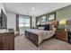 Large main bedroom with a king-size bed and neutral decor at 2827 Blue Mosaic Ln # 3, Las Vegas, NV 89183