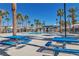 Community pool with lounge chairs and picnic tables at 2827 Blue Mosaic Ln # 3, Las Vegas, NV 89183