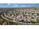 Aerial view of houses and lake, showcasing a large community at 2928 Cape Verde Ln, Las Vegas, NV 89128